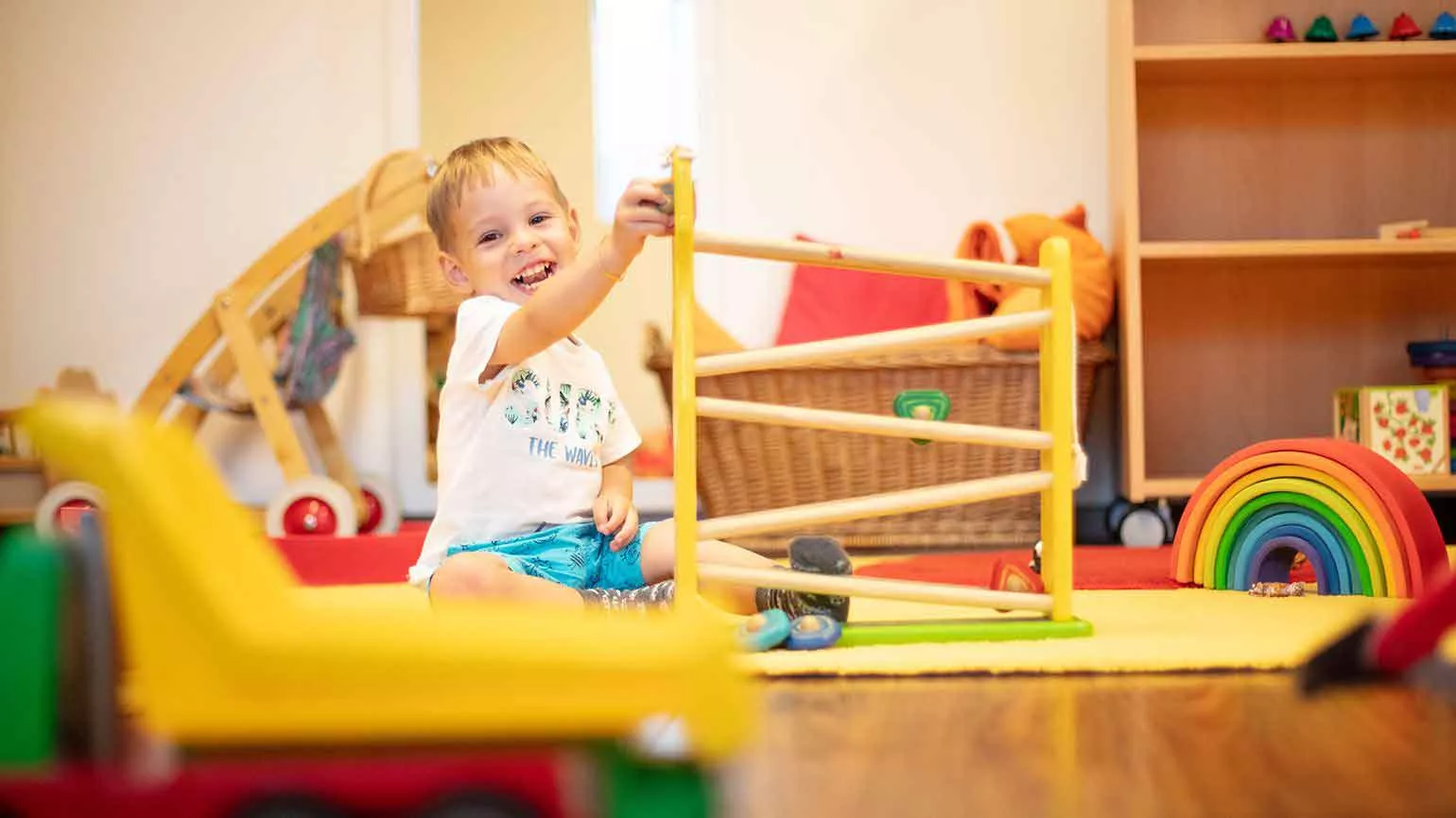 an employee's child playing in the company's childcare facility