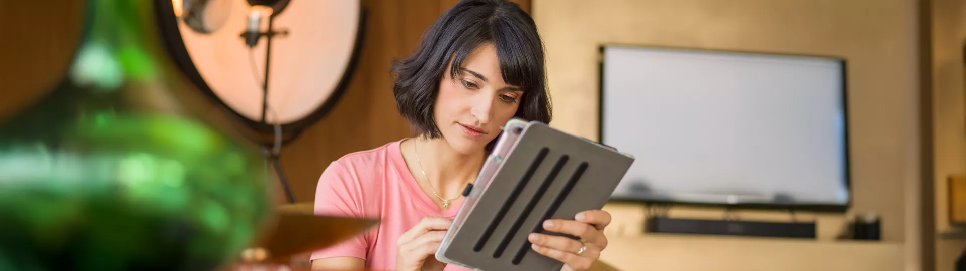 Woman using tablet for monitoring